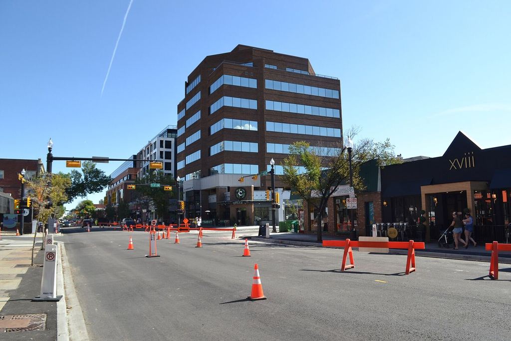 17th Avenue SW in Calgary on a sunny afternoon, shops and restaurants along the street